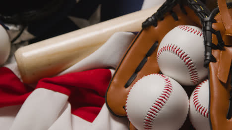 Overhead-Baseball-Still-Life-With-Bat-Ball-And-Catchers-Mitt-On-American-Flag